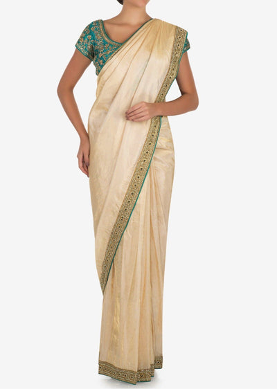 Cream saree with dark green blouse - Indian Clothing in Denver, CO, Aurora, CO, Boulder, CO, Fort Collins, CO, Colorado Springs, CO, Parker, CO, Highlands Ranch, CO, Cherry Creek, CO, Centennial, CO, and Longmont, CO. Nationwide shipping USA - India Fashion X