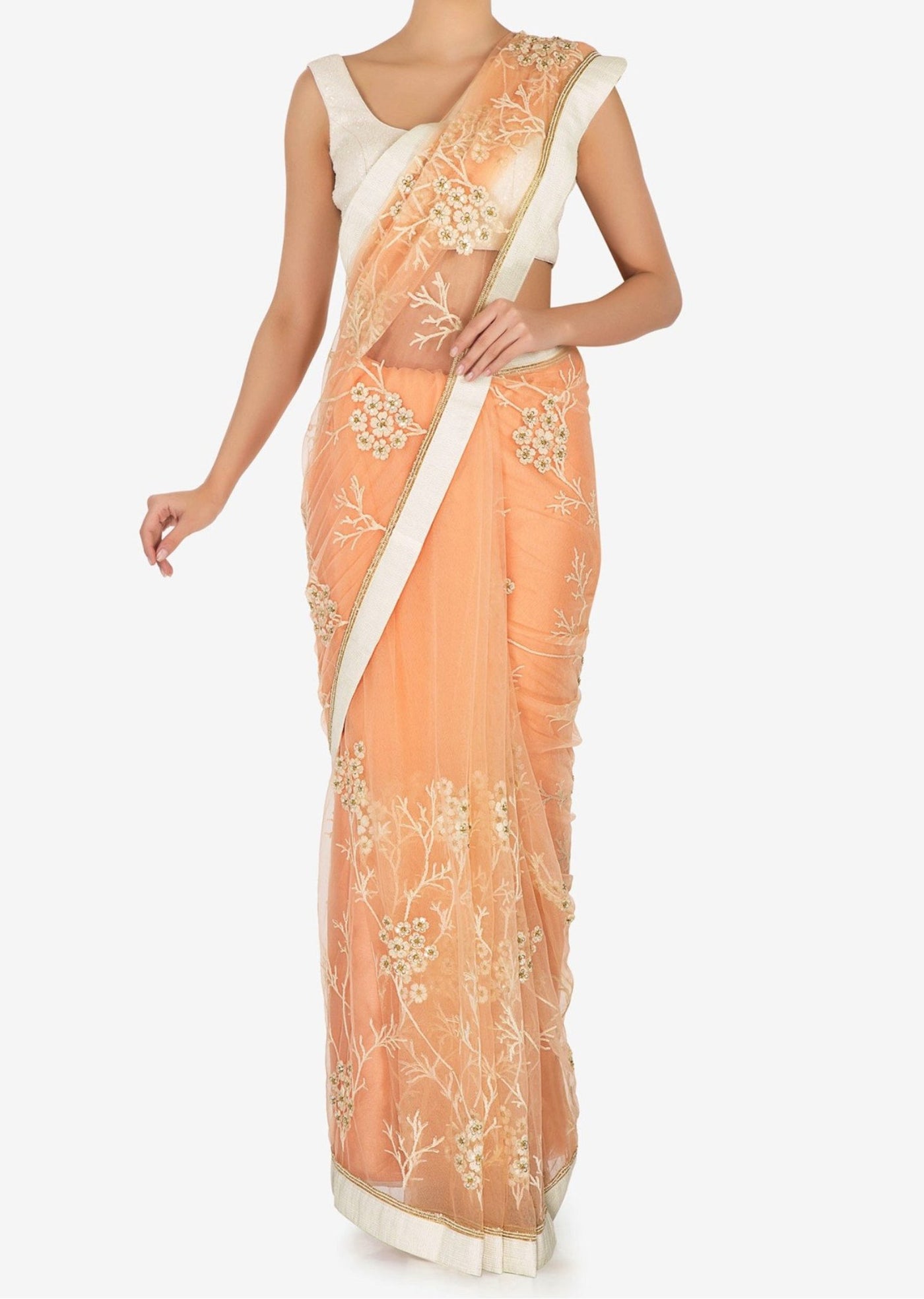 Net saree featured in peach Indian Clothing in Denver, CO, Aurora, CO, Boulder, CO, Fort Collins, CO, Colorado Springs, CO, Parker, CO, Highlands Ranch, CO, Cherry Creek, CO, Centennial, CO, and Longmont, CO. NATIONWIDE SHIPPING USA- India Fashion X