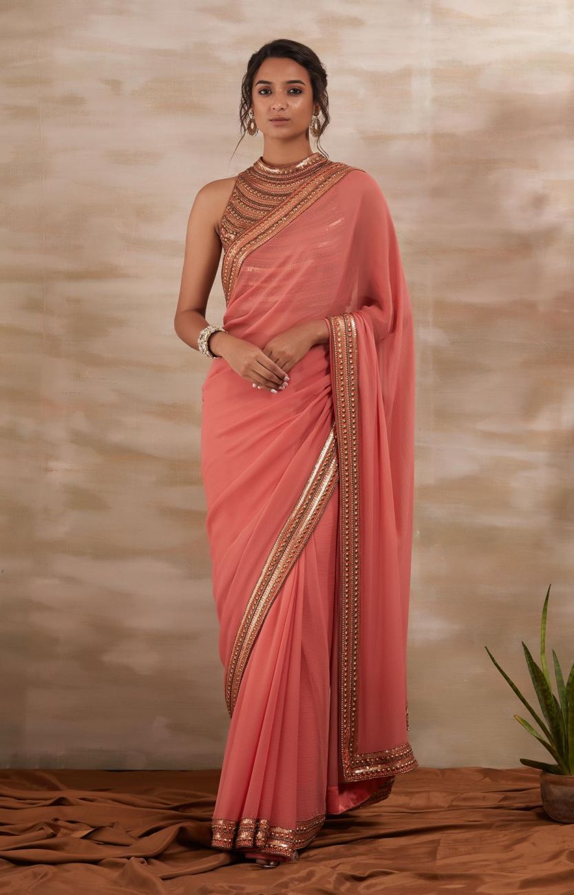 Peach Metal Stud Saree Indian Clothing in Denver, CO, Aurora, CO, Boulder, CO, Fort Collins, CO, Colorado Springs, CO, Parker, CO, Highlands Ranch, CO, Cherry Creek, CO, Centennial, CO, and Longmont, CO. NATIONWIDE SHIPPING USA- India Fashion X